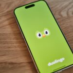 a-green-phone-with-a-face-drawn-on-it