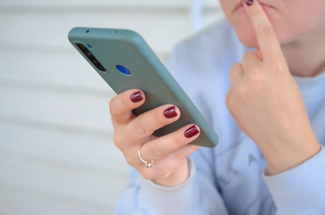 a-person-holding-a-cell-phone